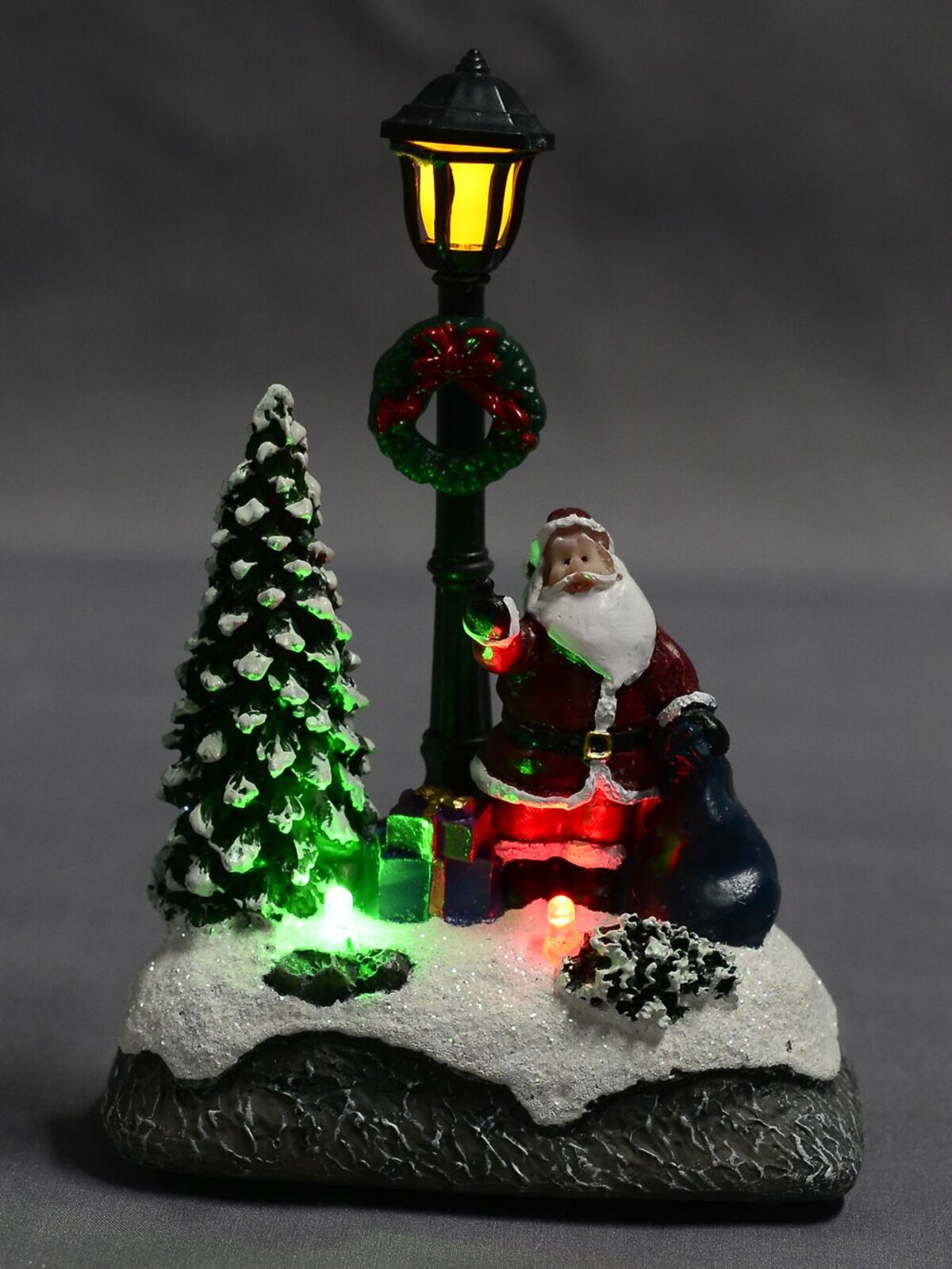 Illuminated Santa with Sack Under a Lamp Post Scene - 12cm